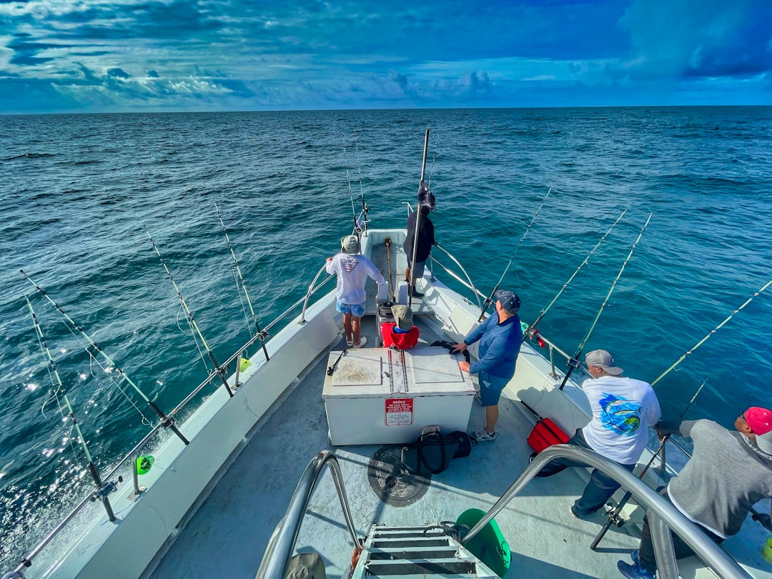 Offshore fishing boat heading into open water, representing fishing charter marketing. Photo by Gene Gallin on Unsplash.